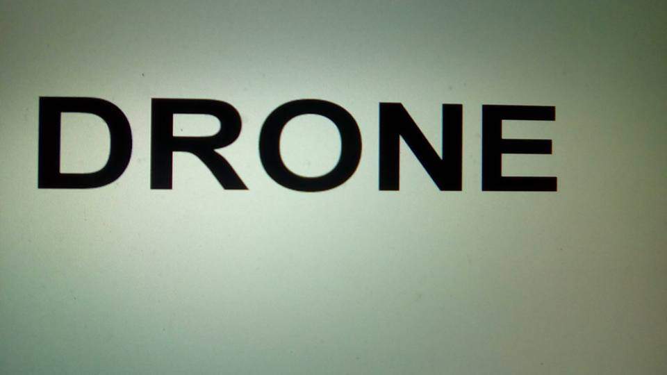 Grey background with the text 'DRONE'