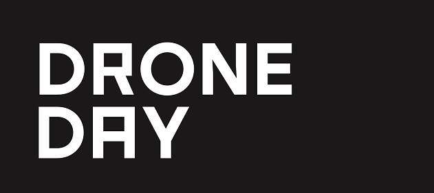 Black poster with white text that says 'DRONE DAY'